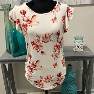 NWT. White blouse with pink and red floral pattern.